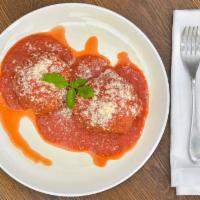 Homemade Meatballs · 2 homemade meatballs served with tomato sauce and parmesan