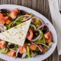 Village Greek Salad (Xoriatiki) · Greek salad made the traditional way with tomatoes, onions, cucumbers, green peppers, feta c...