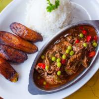 Ropa Vieja Ls · Shredded beef cooked with peppers, tomatoes, onions, cooking wine and spices. Served with wh...