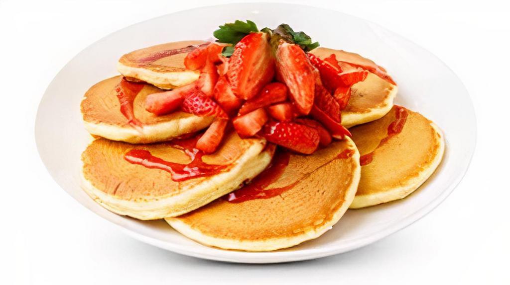 Strawberry Pancakes · 6 buttermilk pancakes topped with fresh strawberries,. whipped cream, powdered sugar and homemade. strawberry syrup.