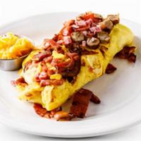3 Meats Omelette · Bacon, ham, sausage & cheddar cheese. Served with Pancakes or Toast.