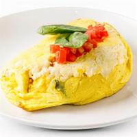 Greek Omelette · Tomatoes, fresh spinach & feta cheese. Served with Pancakes or Toast.