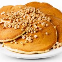 Peanut Butter Chip Cakes · 6 buttermilk pancakes filled with peanut butter chips topped with more peanut butter chips a...