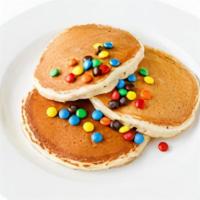 Kids Rainbow Pancakes · Three pancakes with a starburst of colors. from the rainbow.