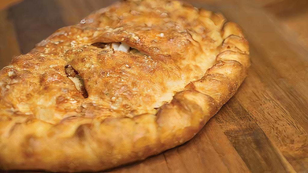 Build Your Own Calzone · Our handmade dough stuffed with our signature three cheeses plus up to five toppings of your choice; served with a side of our original sauce.