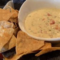 Turkey Sausage Queso · RS turkey sausage with tomatoes, red peppers, jalapeños, and pepper jack cheese - served wit...