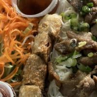 Bun Thit Nuong Cha Gio / Grilled Pork And Egg Rolls · Vermicelli with marinated grilled pork, eggrolls, lettuce, pickle, cucumber bean sprouts, an...