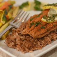 Blackened Catfish · Served with dirty rice and seasonal vegetables