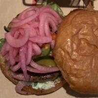 Lamb Burger · border spring gyro patty, arugula, pickled red onion, tzatziki, marinated vegetables