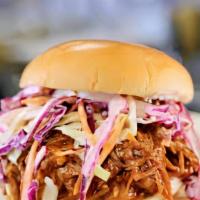Pulled Chicken Sandwich Combo · Tender, succulent, well-seasoned chicken that is pulled and piled high on a bun