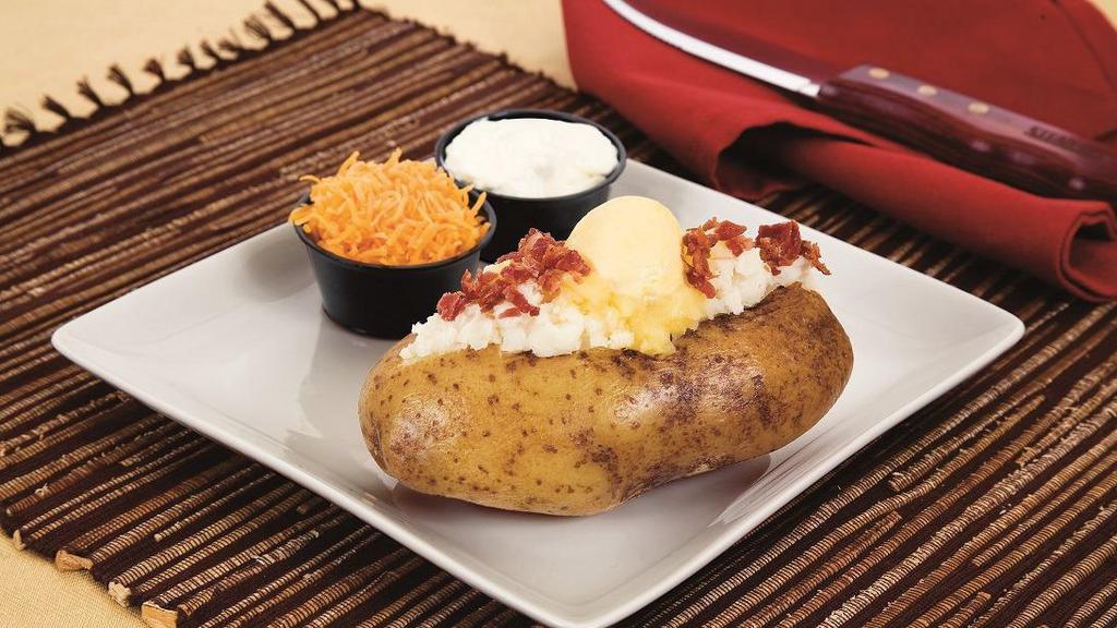 Loaded Baked · With cheddar cheese, hormel® bacon bits, buttery spread and daisy® sour cream.