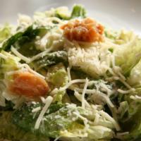 Caesar Salad · Fresh cut romaine lettuce tossed in a creamy caesar dressing with grape tomatoes, croutons &...