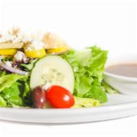 Greek Artichoke Salad · Mixed greens topped with marinated roasted artichoke hearts, tomatoes, cucumbers, banana pep...