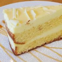 Lemoncello Cake · Alternating layers of sponge cake and lemon infused mascarpone cream.