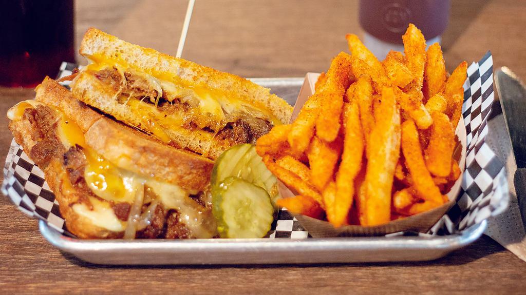 Bbq Grilled Cheese · Made with muenster, cheddar & pepper jackcheese & piled high with our championship pulled pork & sauteed sweet onions on grilled brioche sliced bread.