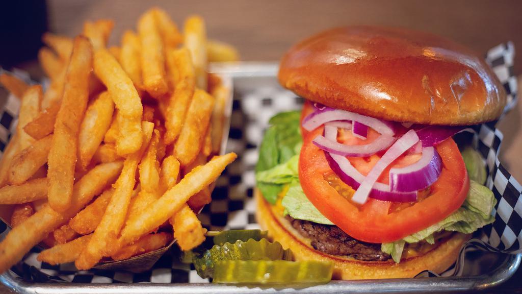 The American Classic Burger · to order & topped with lettuce, tomato, onion & Our handcrafted classic sirloin burger cooked American cheese served on a bun & your choice of one side.