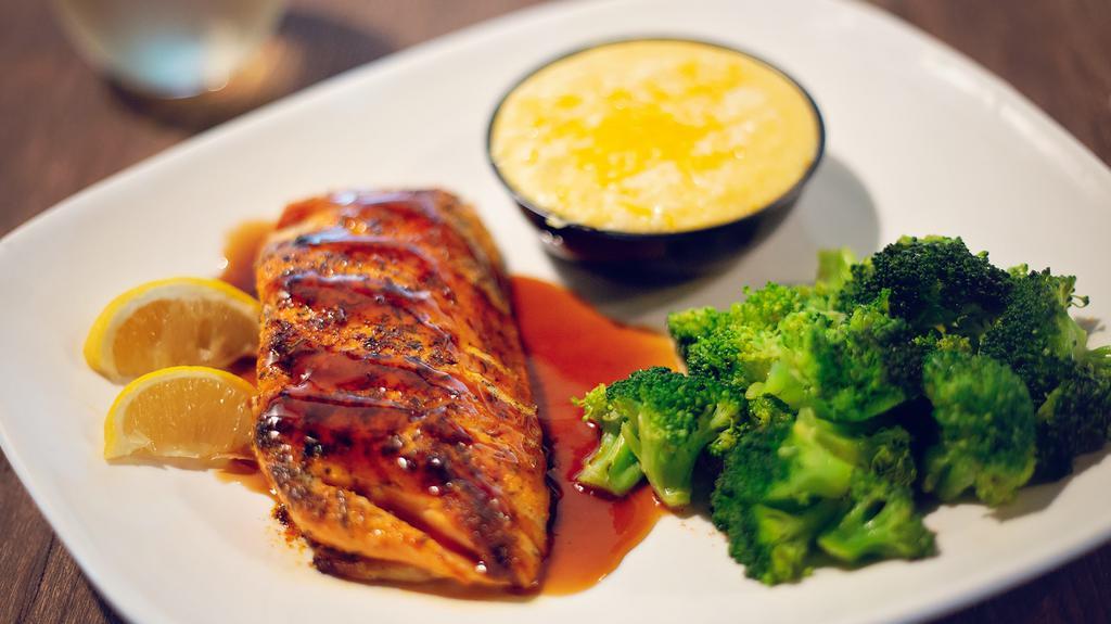Hand-Cut Salmon · A Salmon fillet seared to perfection & served with your choice of lemon butter or our special bourbon glaze & your  choice of 2 sides.