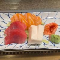 Sashimi Appetizer · Seven pieces assorted raw fish.