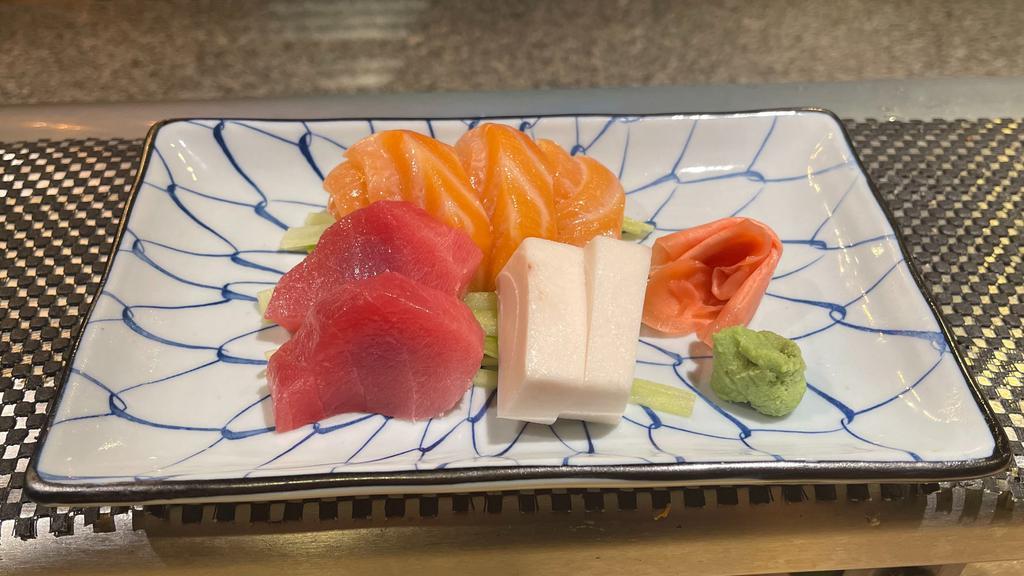 Sashimi Appetizer · Seven pieces assorted raw fish.