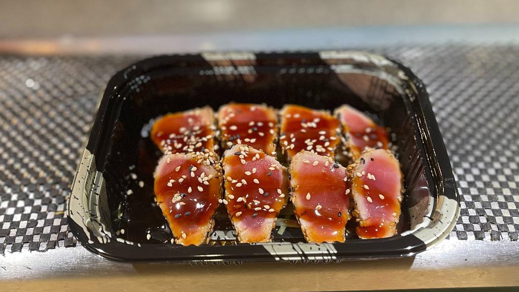 Sesame Tuna · Seared sesame coated tuna with Japanese dressing.