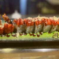 Godzilla Roll · Shrimp tempura, cream cheese inside spicy tuna on top with spicy sauce.