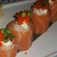 Salmon Bites · Rice wrapped with salmon and topped with cream cheese, tobiko and scallions.