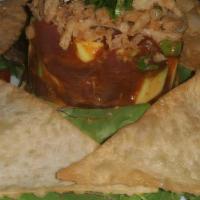 Crunchy Tuna Tartar · Diced tuna mix with kimchee, sesame oil, avocado and tempura flakes. Served with crispy wont...