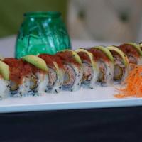 Tiger Roll · Shrimp tempura and crab salad topped with spicy tuna, avocado and eel sauce.