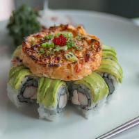 Volcano Roll · Crab and cream cheese topped with avocado and dynamite.