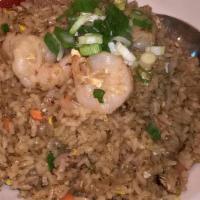 Fried Rice · Stir-fried rice with eggs, onions, scallions, carrots and mushrooms.