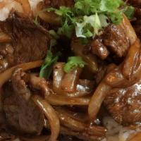 Ginger Beef · Wok beef with ginger, onions, scallions and mushrooms.