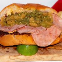 Tortas De La Barda (Tampico Style Sandwich) · Mexican bolillo bread with refried black beans, fresh ham, avocado slices, Cheddar cheese, M...