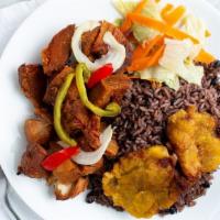 Griot · Served with rice or plaintains.