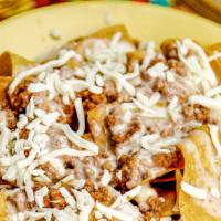 Nachos · Cheese dip , black beans, refried beans or ground beef.
Includes fountain drink
