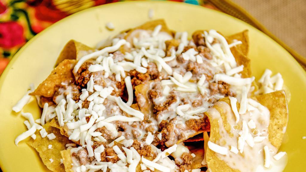 Nachos · Cheese dip , black beans, refried beans or ground beef.
Includes fountain drink