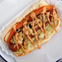 Surf & Turf Dog · Grilled hot dog topped with super lump crab meat, lettuce, tomatoes, and try me sauce.