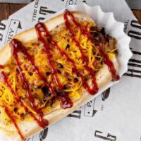 Hawaiian Dog · Grilled beef hot dog topped with bacon, cheese, BBQ sauce, grilled onions, and grilled pinea...