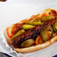 Fire Dog · Beef hot dog topped with Arizona heat hot sauce, jalapeno peppers, and sport peppers.