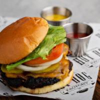 Factory Burger · 1/2 pound of 100% angus beef with lettuce, tomatoes, onions, and pickles on request