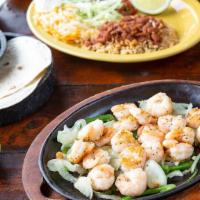 Shrimp Fajitas* · Grilled shrimp served on a sizzling skillet with freshly grilled onions and peppers. Served ...