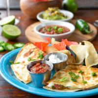 Quesadillas · A flour tortilla filled with fresh pico de gallo, cheese and your choice of shredded chicken...