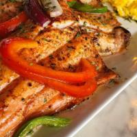 Grilled Cajun Salmon & Grits · Salmon Grilled with Cajun spices. Served with two eggs , Grits or Home Fries, Biscuit or Toa...