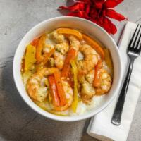 Shrimp And Grits  · Shrimp and Tri Colored Peppers Sauteed  in Garlic Butter Sauce served over Creamy Grits.