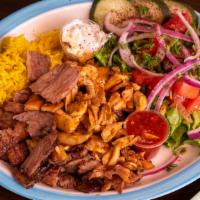 Mixed Grill · Beef shish, kefta kabob and chicken tawook served with hummus and pita bread.