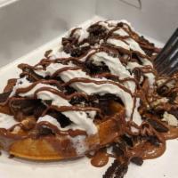 Oreo Madness · Oreo infused waffle batter topped with chocolate syrup and a scoop of cookies and creme ice ...