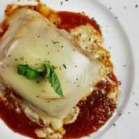 Baked Lasagna · Layers of pasta, ricotta cheese, meat, and Italian spices topped with Romano and melted mozz...