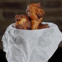 Fried Chicken Wings · With spicy chipotle and BBQ sauce on the side.