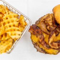 Classic Cheddar & Bacon Burger · Applewood bacon & Cheddar burger on brioche bun with seasoned waffle fries.