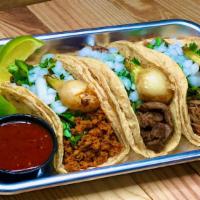Street Tacos  · Three steak tacos served on corn tortilla, fresh cilantro, fresh onions, grilled cambrey oni...
