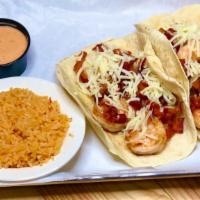 Shrimp Bacon Tacos  · Two flour tortillas stuffed with grilled shrimp, bacon, shredded cheese, served with rice an...
